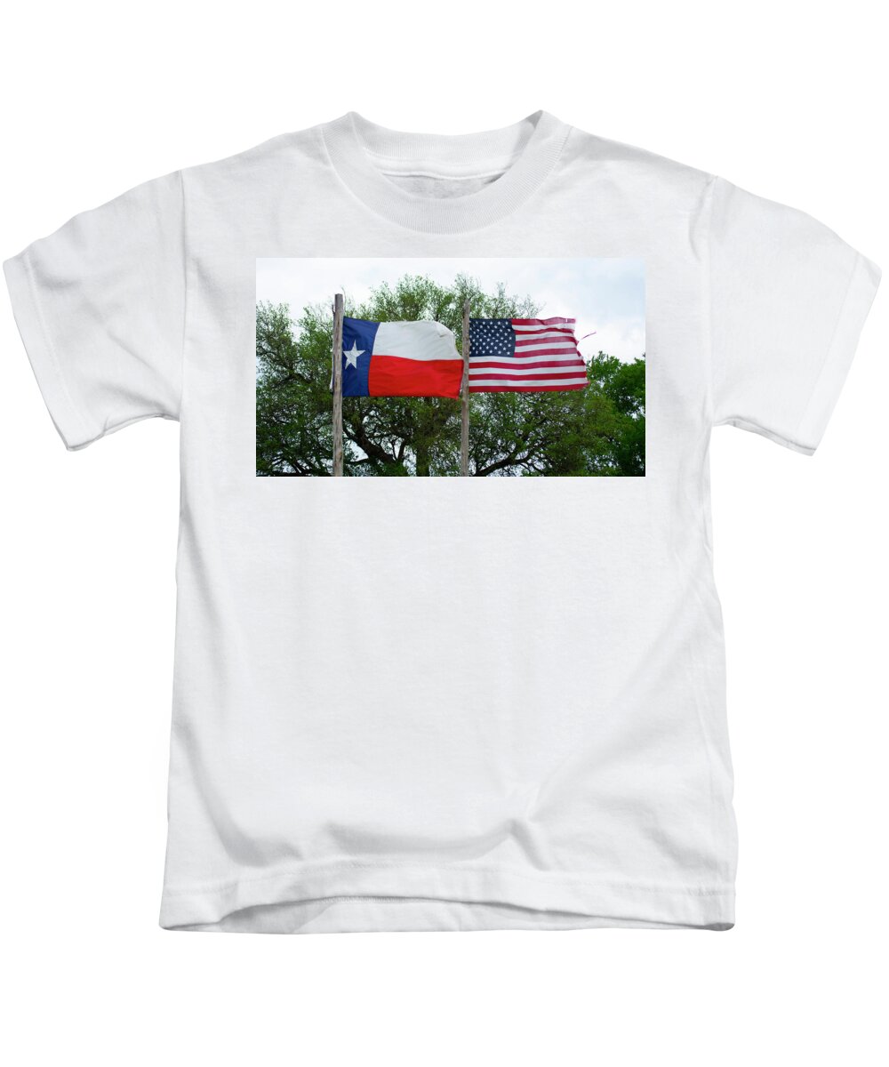United States Kids T-Shirt featuring the photograph Flags Flying In The Wind by Patrick Nowotny