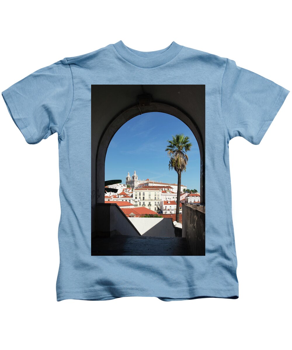 Alfama Kids T-Shirt featuring the photograph Alfama throught the arch by Moura Pereira
