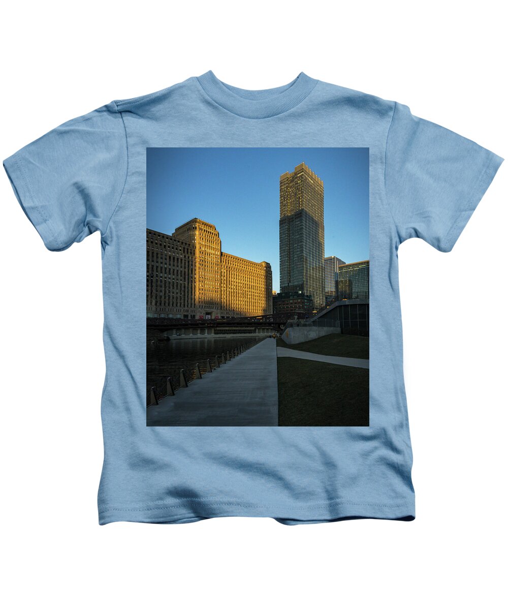 Chicago Riverwalk Merchandise Mart Kids T-Shirt featuring the photograph Shadows of the City by Laura Hedien