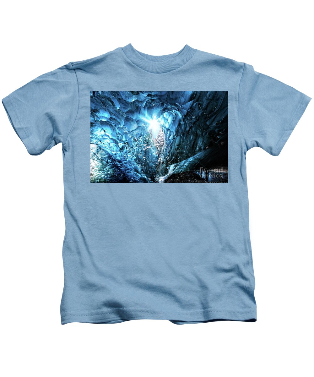 Adventure Kids T-Shirt featuring the photograph Blue glacial ice with hole through to the sky with sunburst, fr by Jane Rix