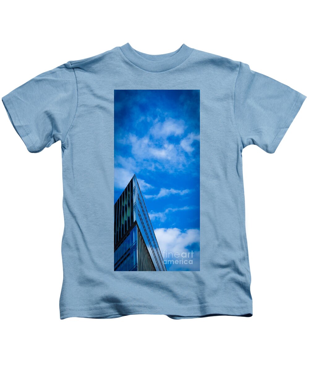 Building Kids T-Shirt featuring the photograph Futuristic triangular building against a clear blue sky by Mendelex Photography