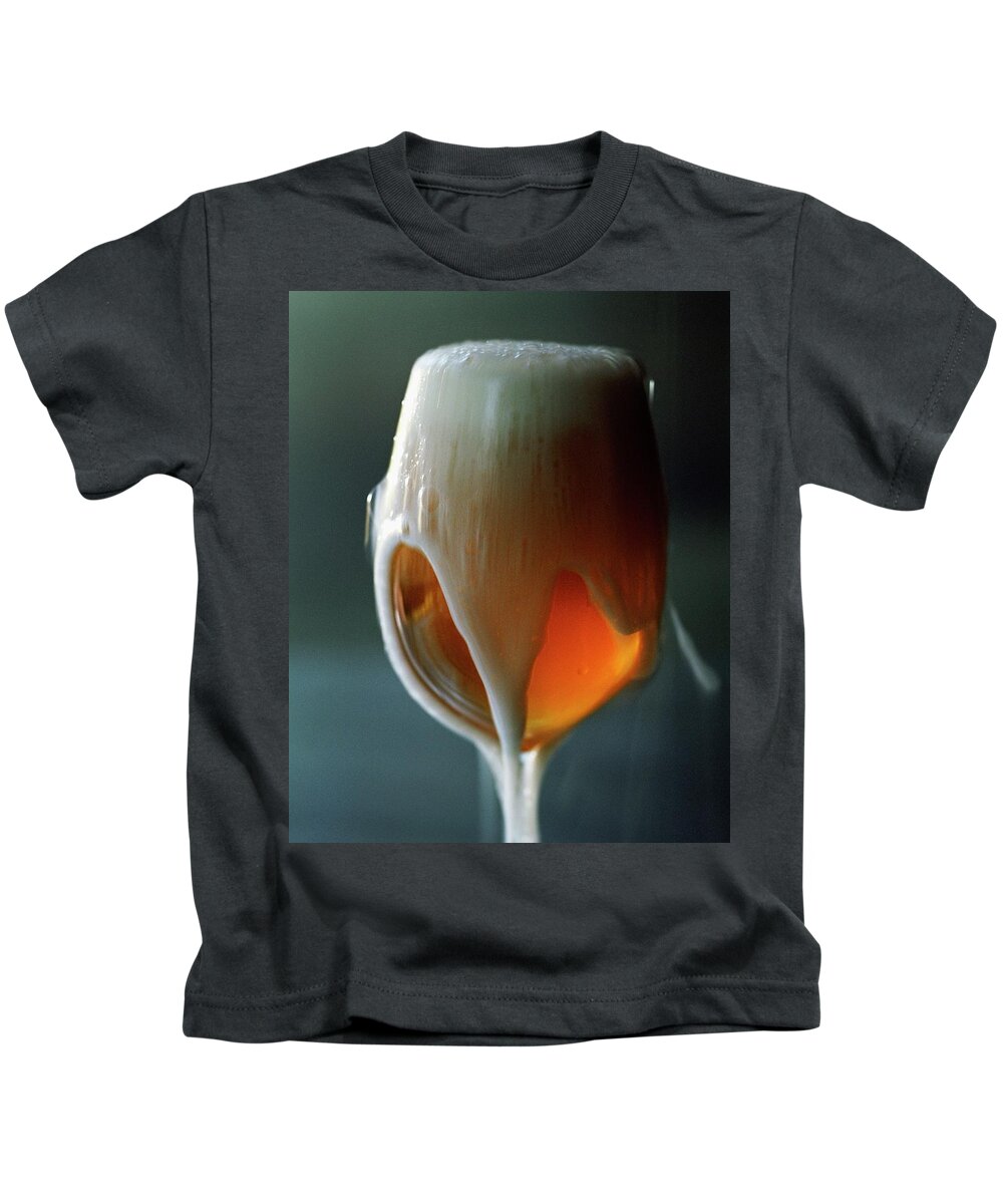 Beverage Kids T-Shirt featuring the photograph A Glass Of Beer #1 by Romulo Yanes