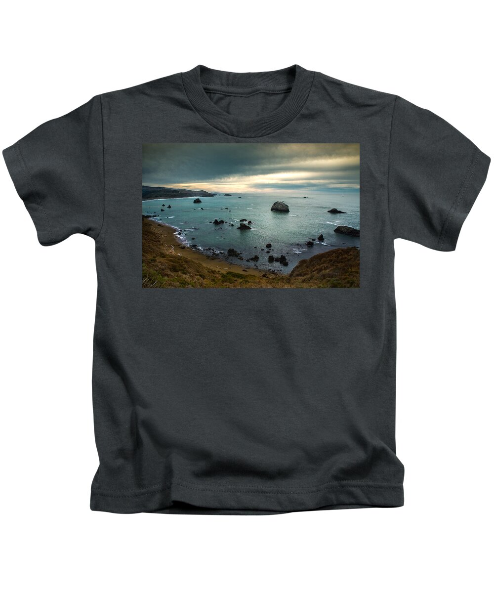 Ocean Kids T-Shirt featuring the photograph A Dark Day at Sea by Bryant Coffey