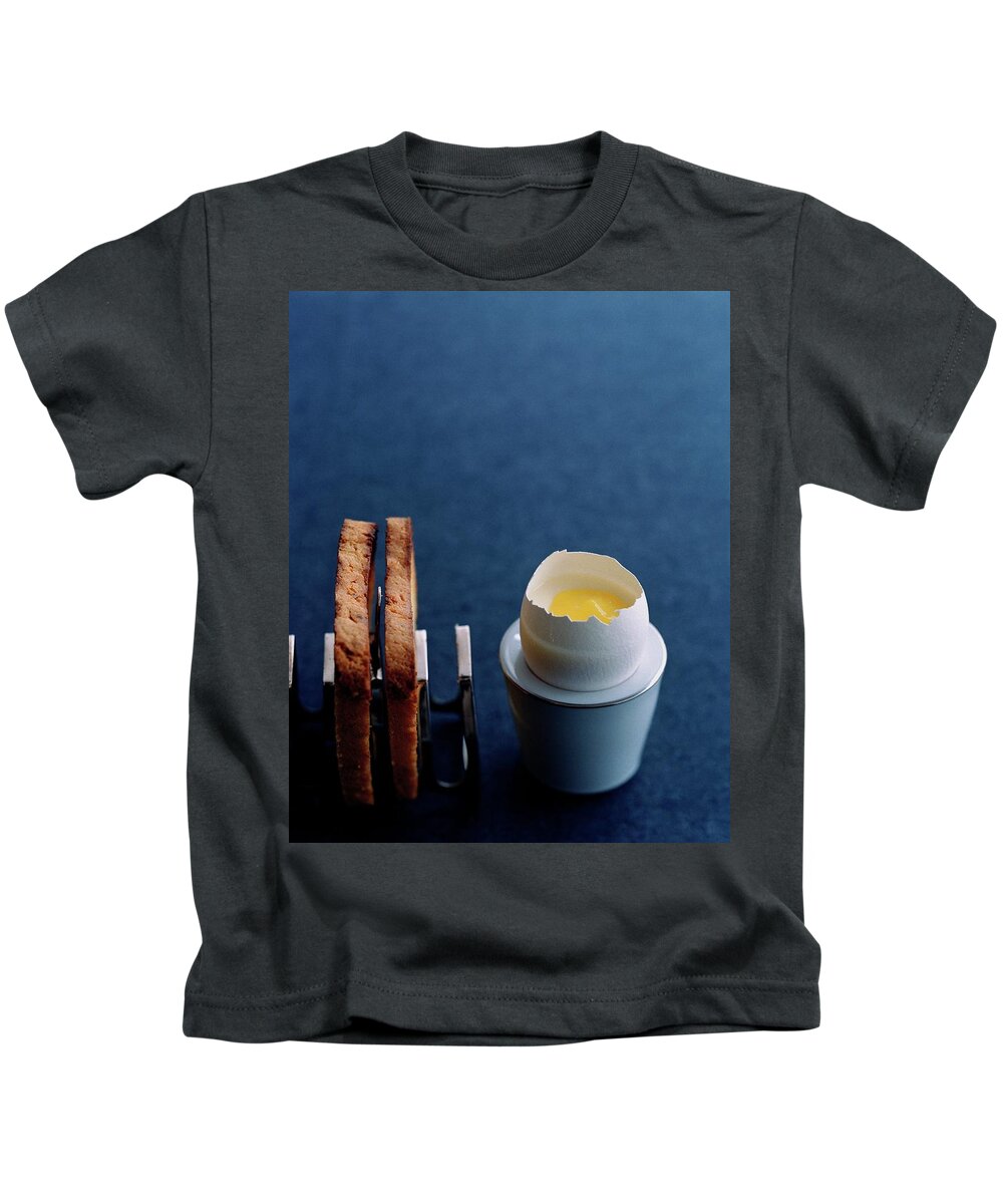 Cooking Kids T-Shirt featuring the photograph A Dessert Made To Look Like An Egg And Toast by Romulo Yanes