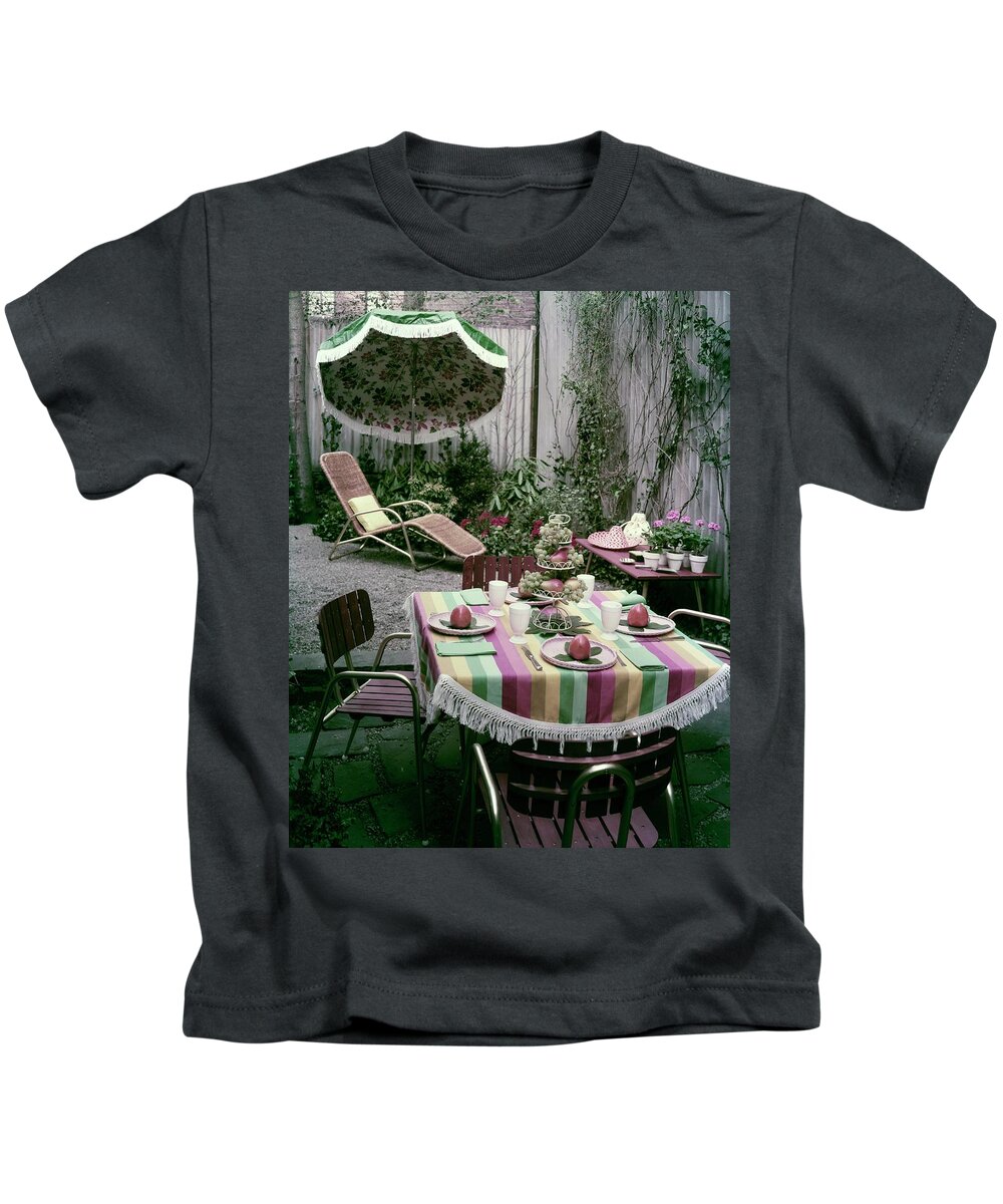 Harold Schwartz Kids T-Shirt featuring the photograph A Garden Set Up For Lunch by Tom Leonard