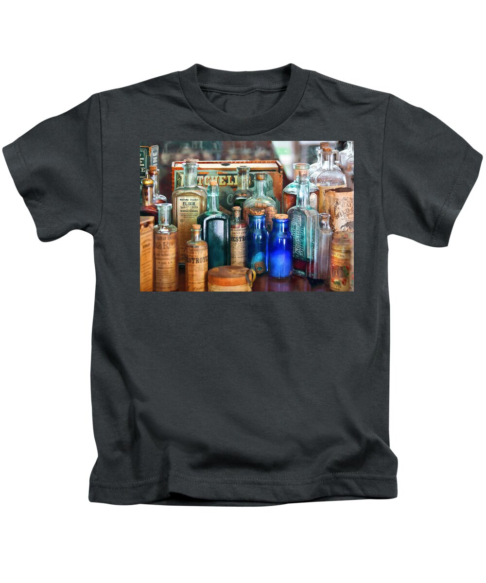 Pharmacy Kids T-Shirt featuring the photograph Apothecary - Remedies for the Fits by Mike Savad