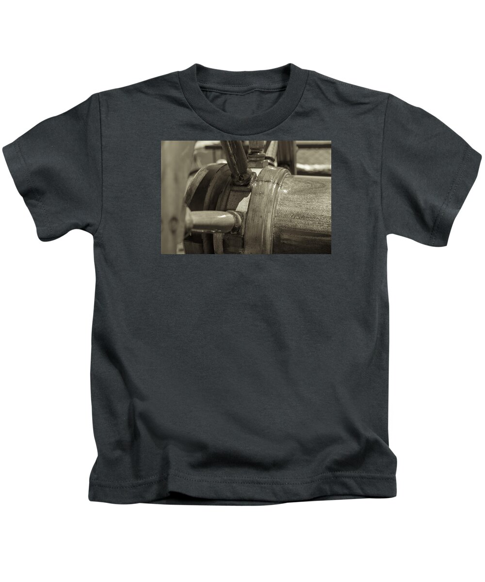 Ships Wheel Kids T-Shirt featuring the photograph At The Helm Black and White Sepia by Scott Campbell