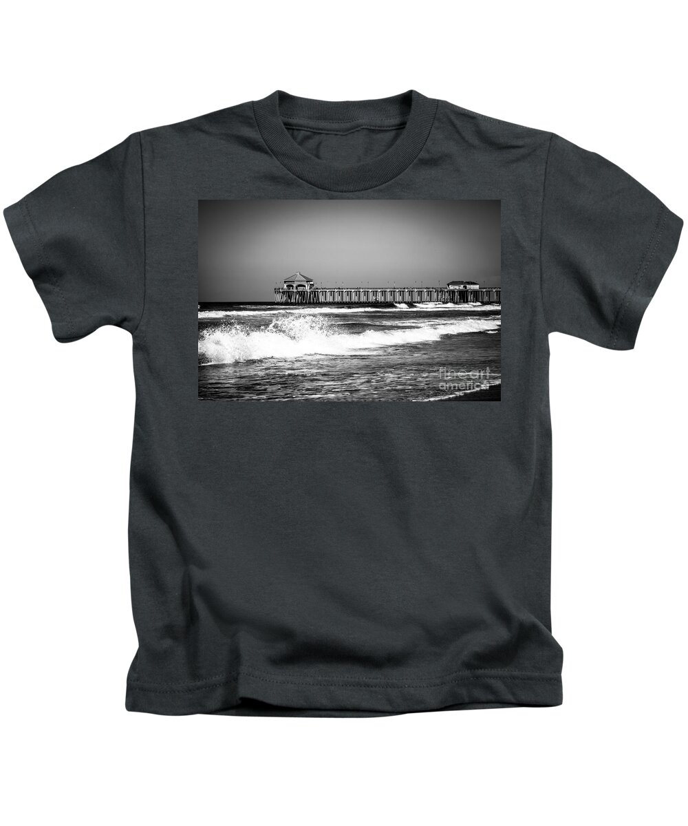 America Kids T-Shirt featuring the photograph Black and White Picture of Huntington Beach Pier by Paul Velgos