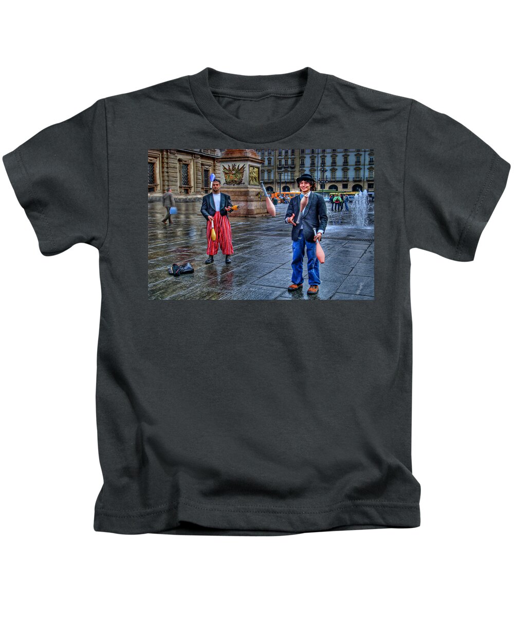 Jugglers Kids T-Shirt featuring the photograph City Jugglers by Ron Shoshani
