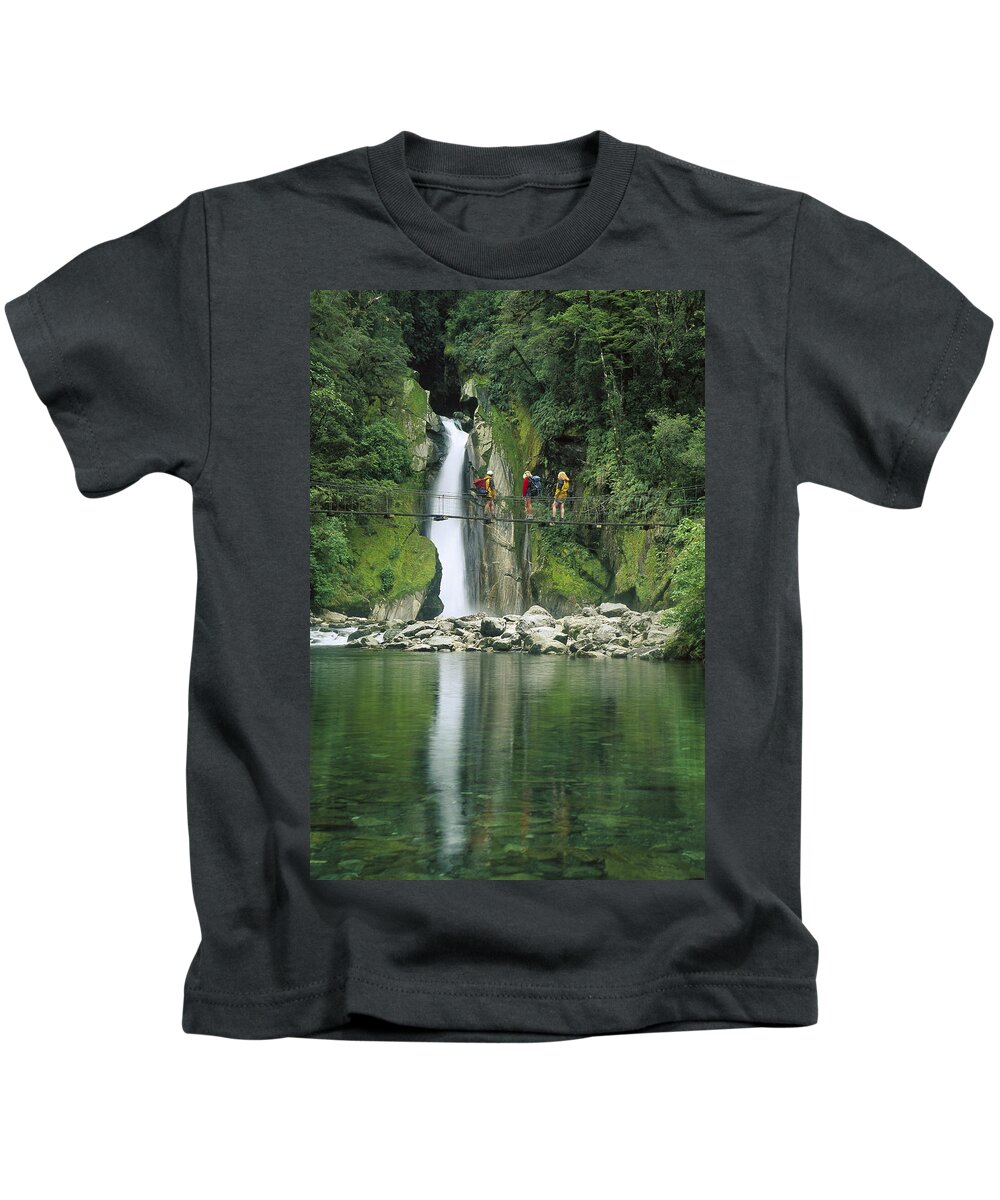 Feb0514 Kids T-Shirt featuring the photograph Hikers On Bridge Giants Gates Falls by Colin Monteath