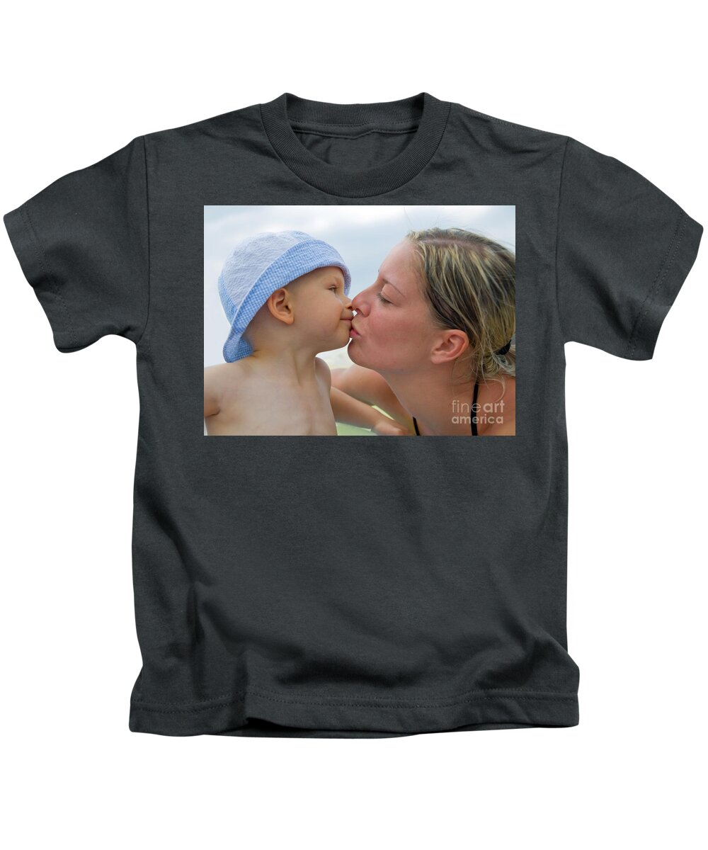 Baby Kids T-Shirt featuring the photograph Mother kissing her child by Michal Bednarek