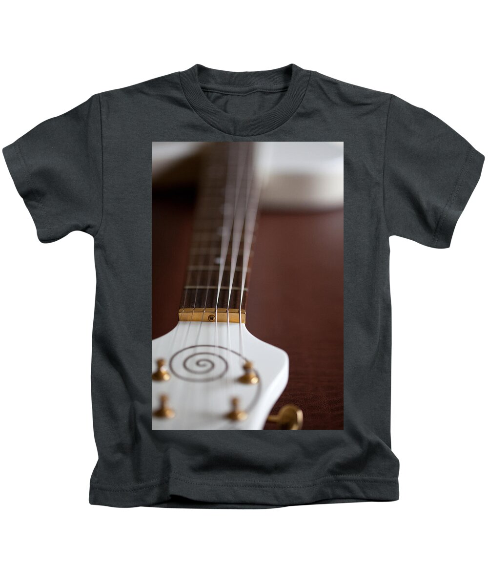 Guitar Kids T-Shirt featuring the photograph On A Glance by Karol Livote