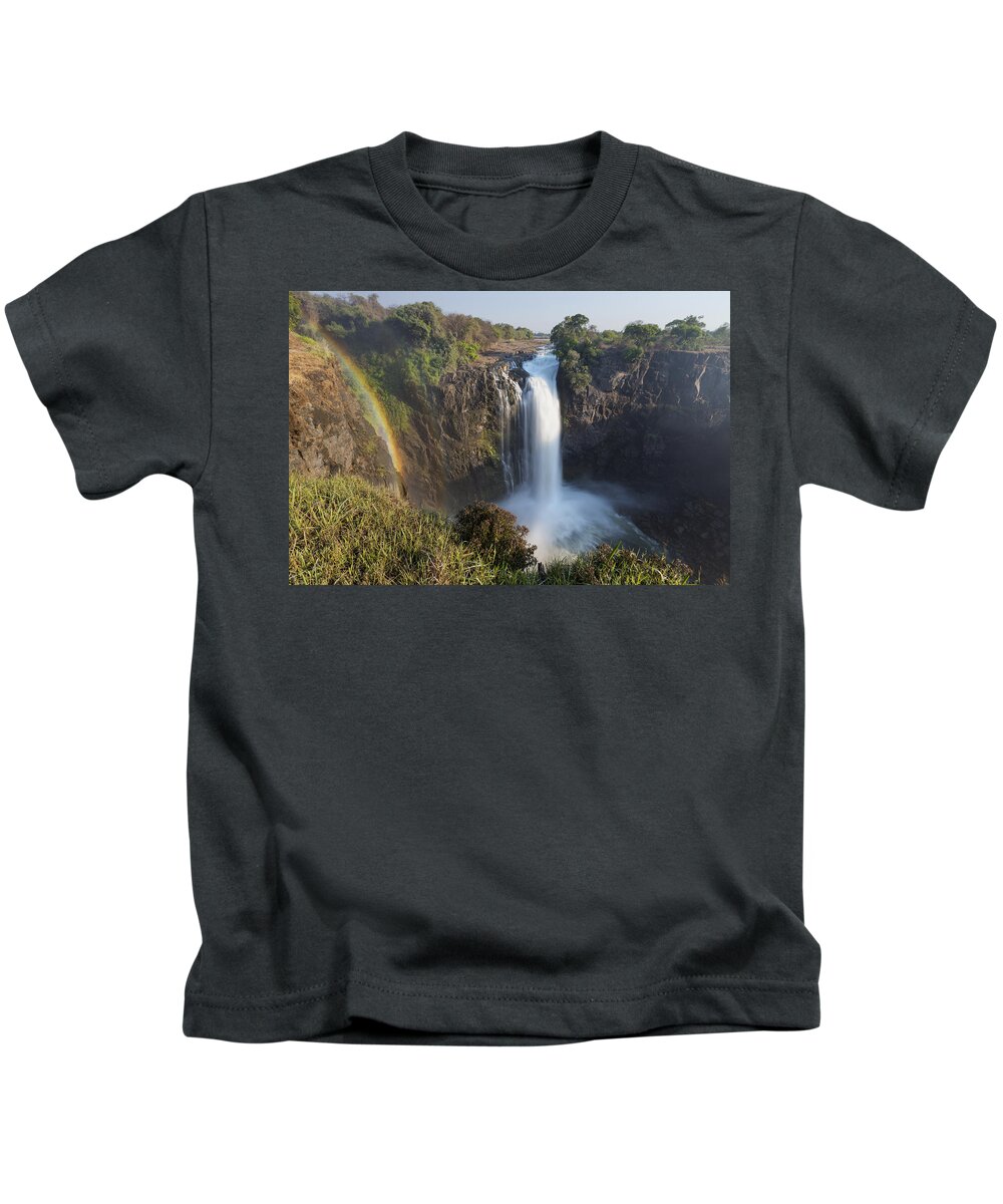Vincent Grafhorst Kids T-Shirt featuring the photograph Rainbow In The Mist Of Victoria Falls by Vincent Grafhorst