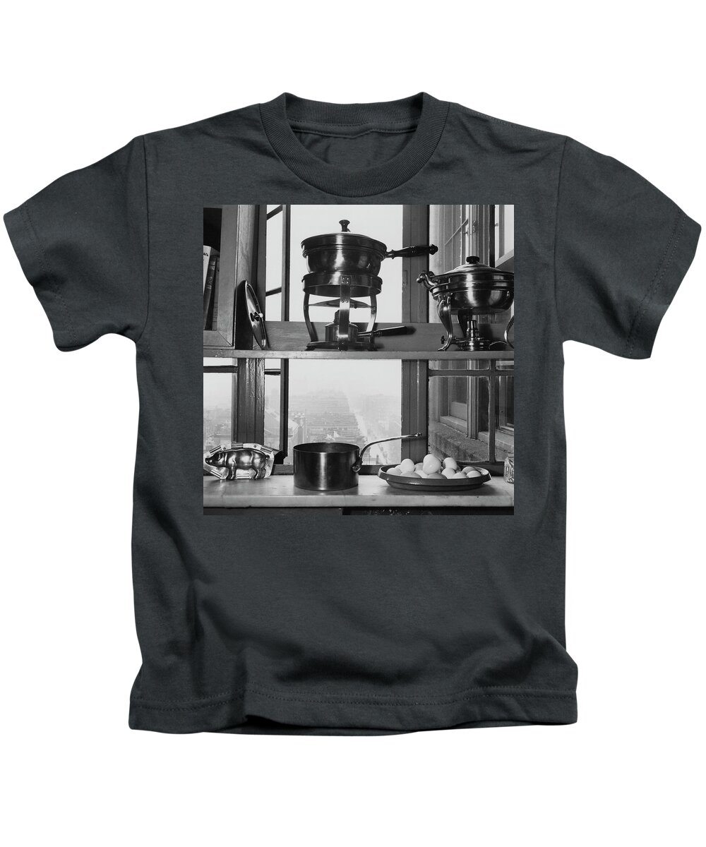 Kitchen Kids T-Shirt featuring the photograph Shelves In Front Of A Window In Vivian Roome's by Luis Lemus