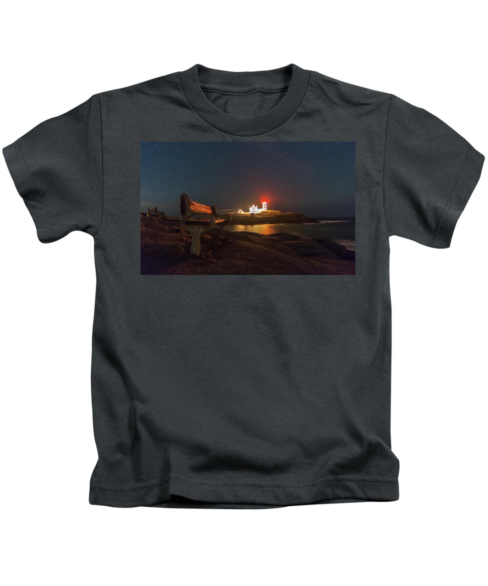 Nubble Light Kids T-Shirt featuring the photograph Starry skies over Nubble Lighthouse by Bryan Xavier
