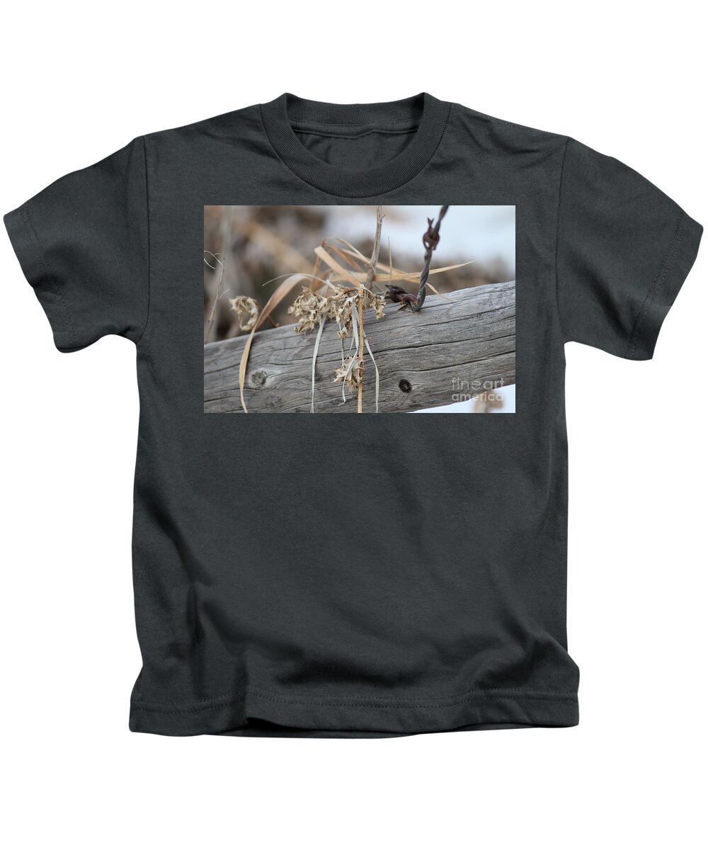 Barbed Wire Kids T-Shirt featuring the photograph Thistles and Barbed Wire by Ann E Robson