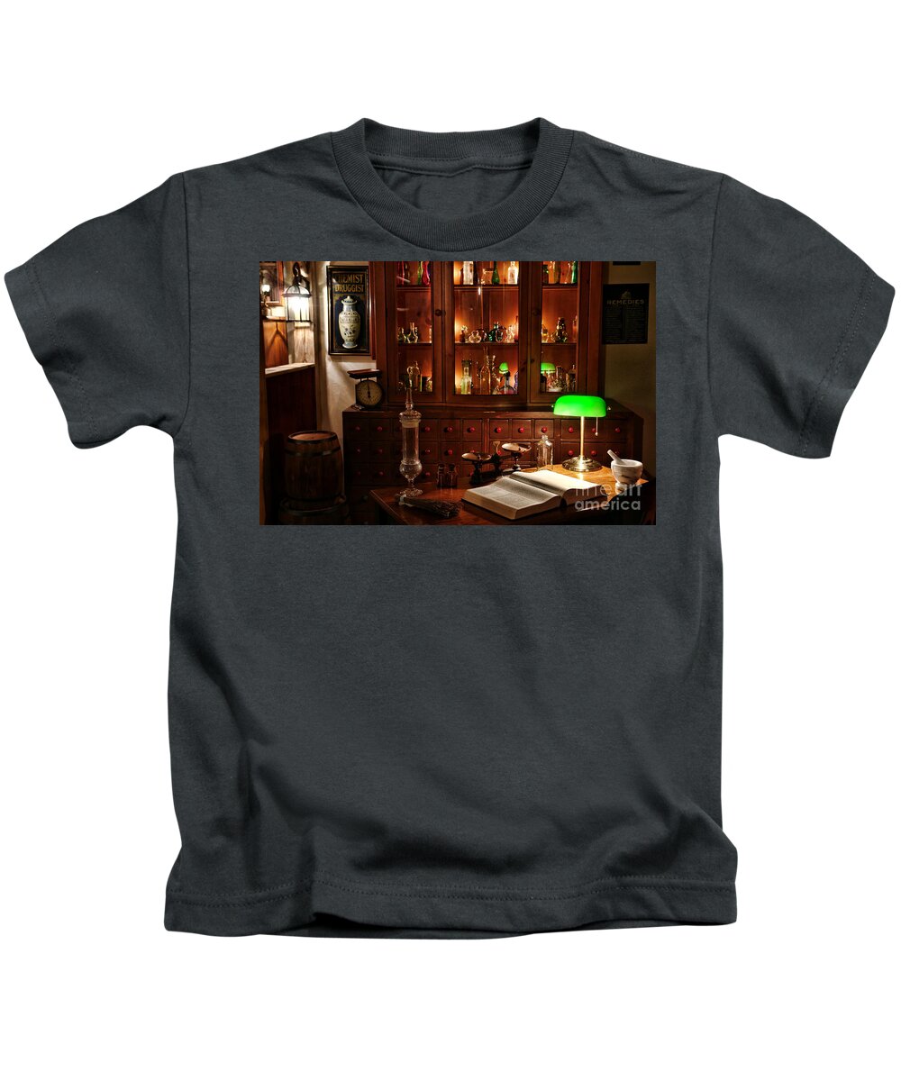Apothecary Kids T-Shirt featuring the photograph Vintage Apothecary Shop by Olivier Le Queinec