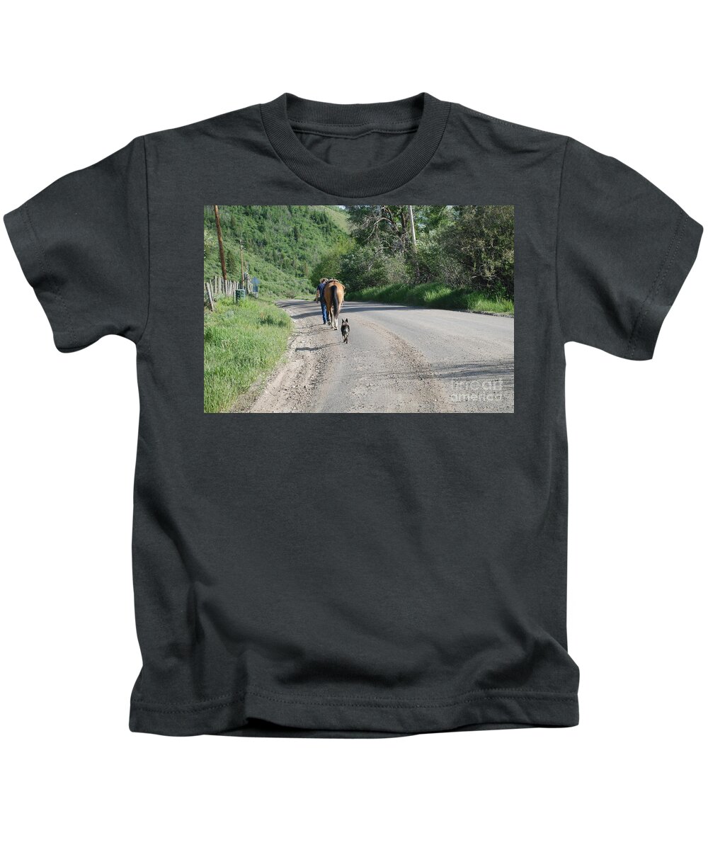Cowboys Kids T-Shirt featuring the photograph Going Home #1 by Jim Goodman