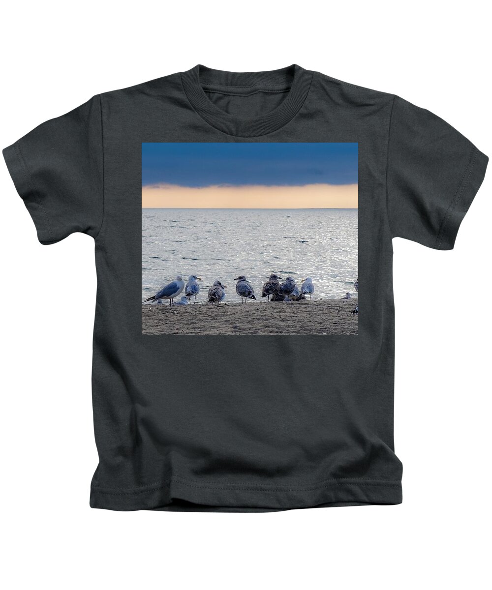  Kids T-Shirt featuring the photograph Birds on a beach by Kendall McKernon