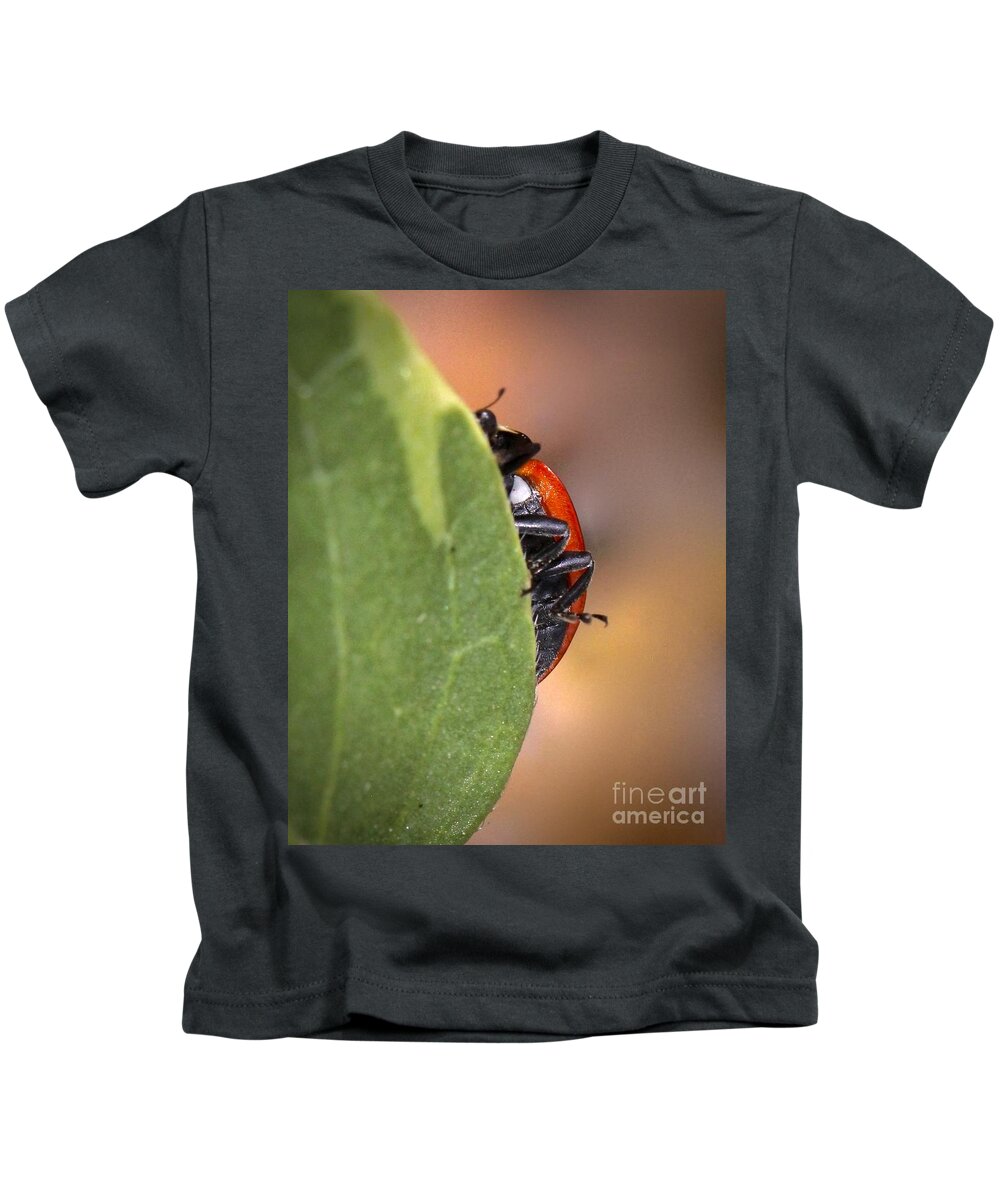 Ladybug Kids T-Shirt featuring the photograph Camara shy by Elisabeth Derichs