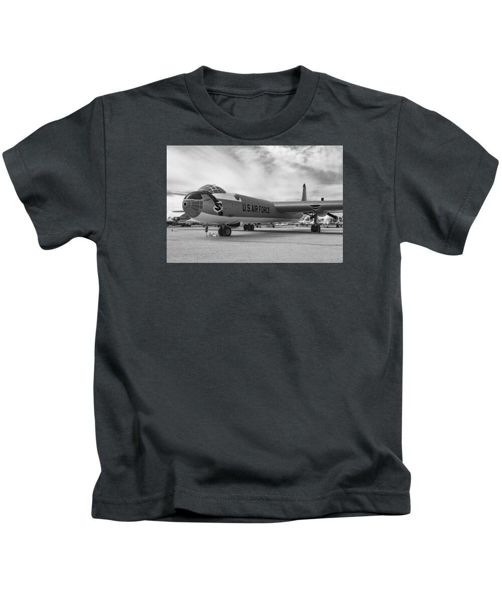 Convair B-36 Peacemaker. The B-36 Was A Strategic Bomber Built By Convair And Operated By The United States Air Force From 1949 To 1959. The Peacemaker Was The Largest Mass-produced Piston Engine Aircraft Ever Made. Kids T-Shirt featuring the photograph Convair B-36 Peacemaker by Rick Pisio