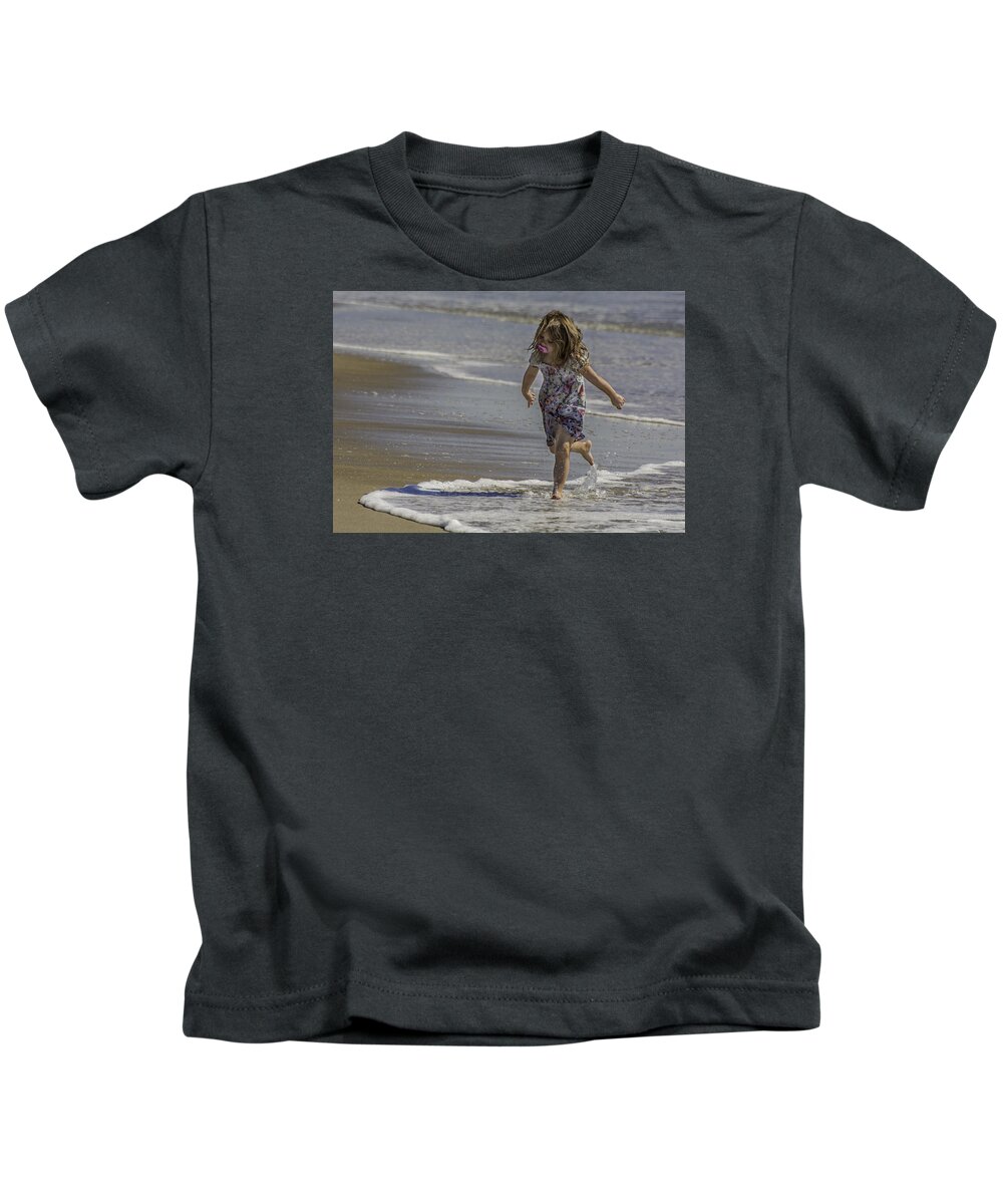 Dancing Kids T-Shirt featuring the photograph Dancing in the surf with a pink pacifier by WAZgriffin Digital