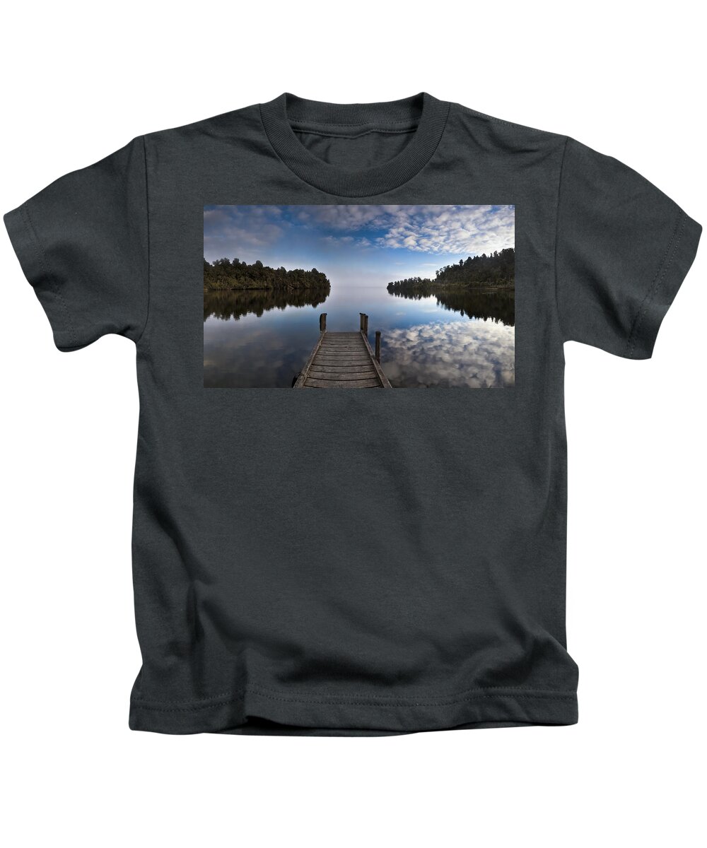 Hhh Kids T-Shirt featuring the photograph Dock In Misty Lake Mapourika Westland by Colin Monteath