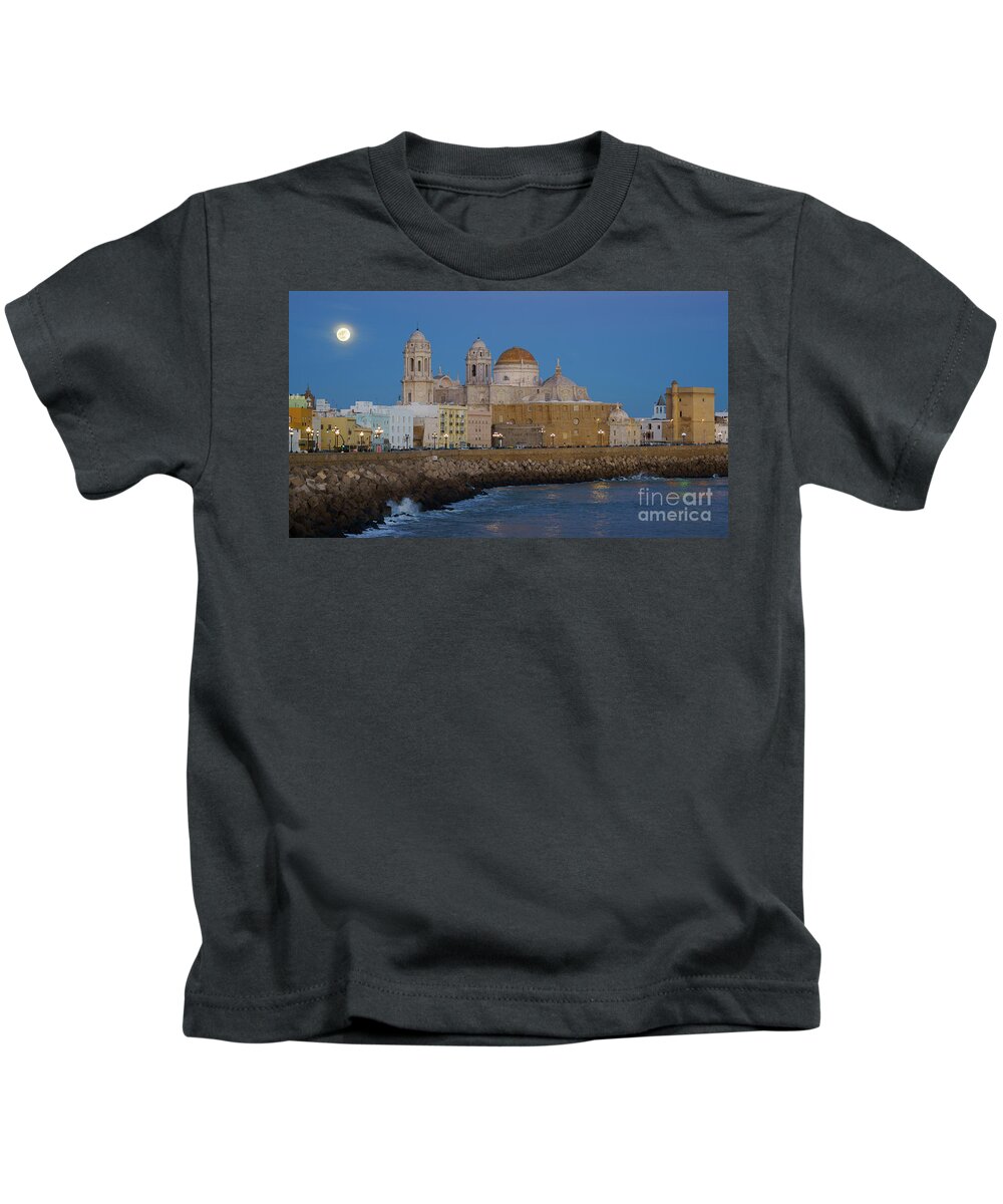 Tour Tourism Kids T-Shirt featuring the photograph Full Moonrise Over the Cathedral Cadiz Spain by Pablo Avanzini