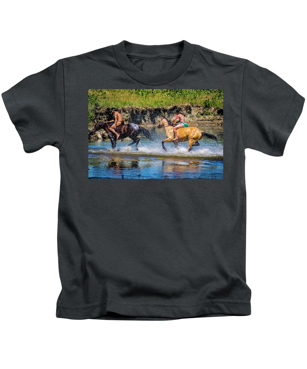 Little Bighorn Re-enactment Kids T-Shirt featuring the photograph Indian Warriors Crossing Little Bighorn River by Donald Pash