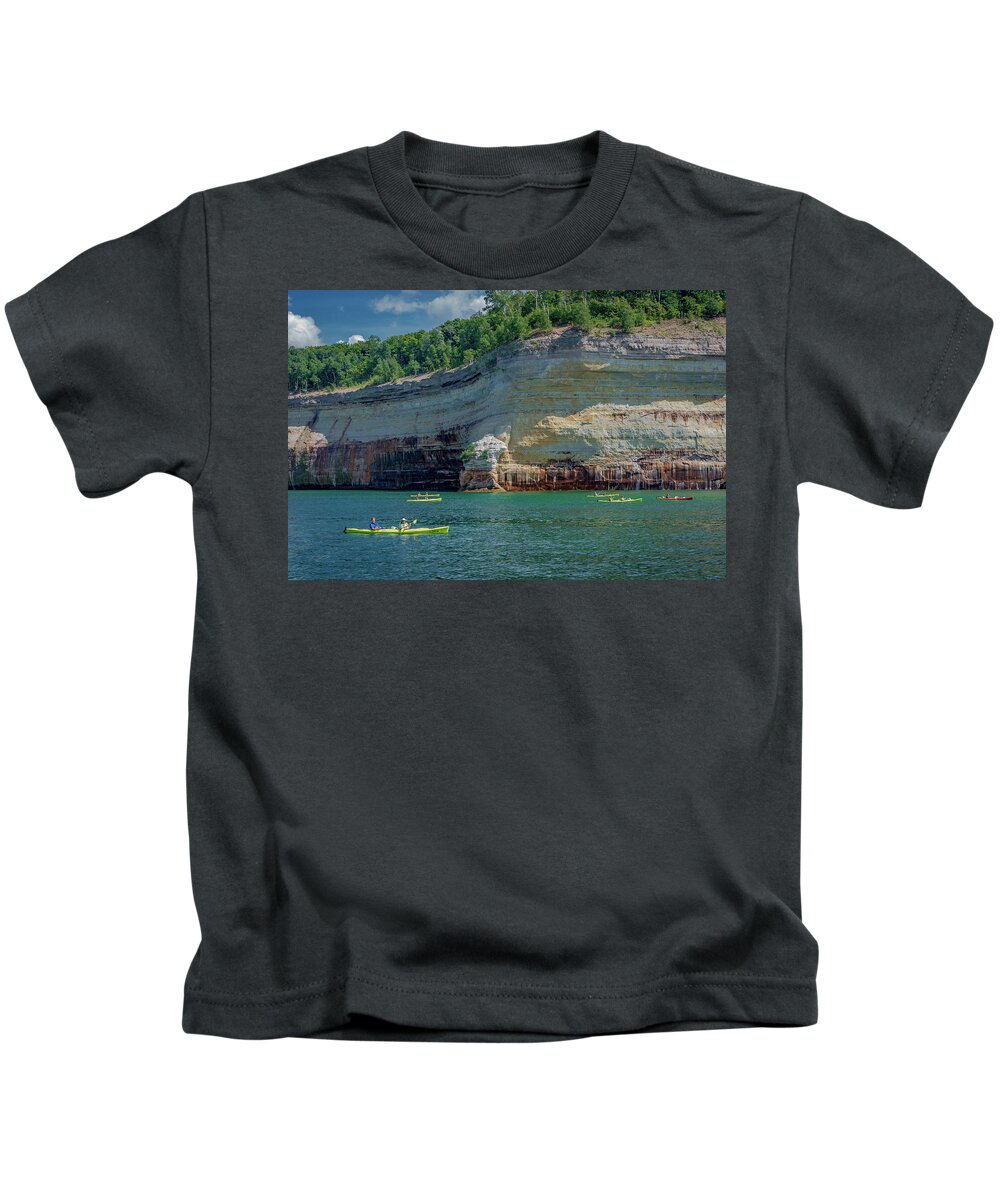 Pictured Rocks National Lakeshore Kids T-Shirt featuring the photograph Kayaking the Pictured Rocks by Gary McCormick