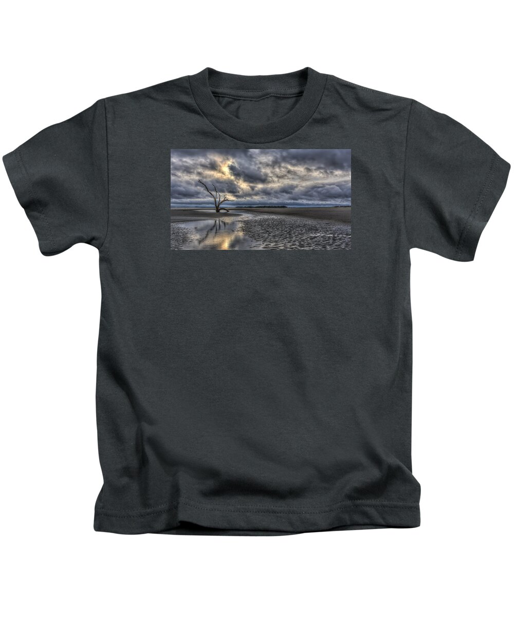 Tree Kids T-Shirt featuring the photograph Lone Tree Under Moody Skies by Harry B Brown