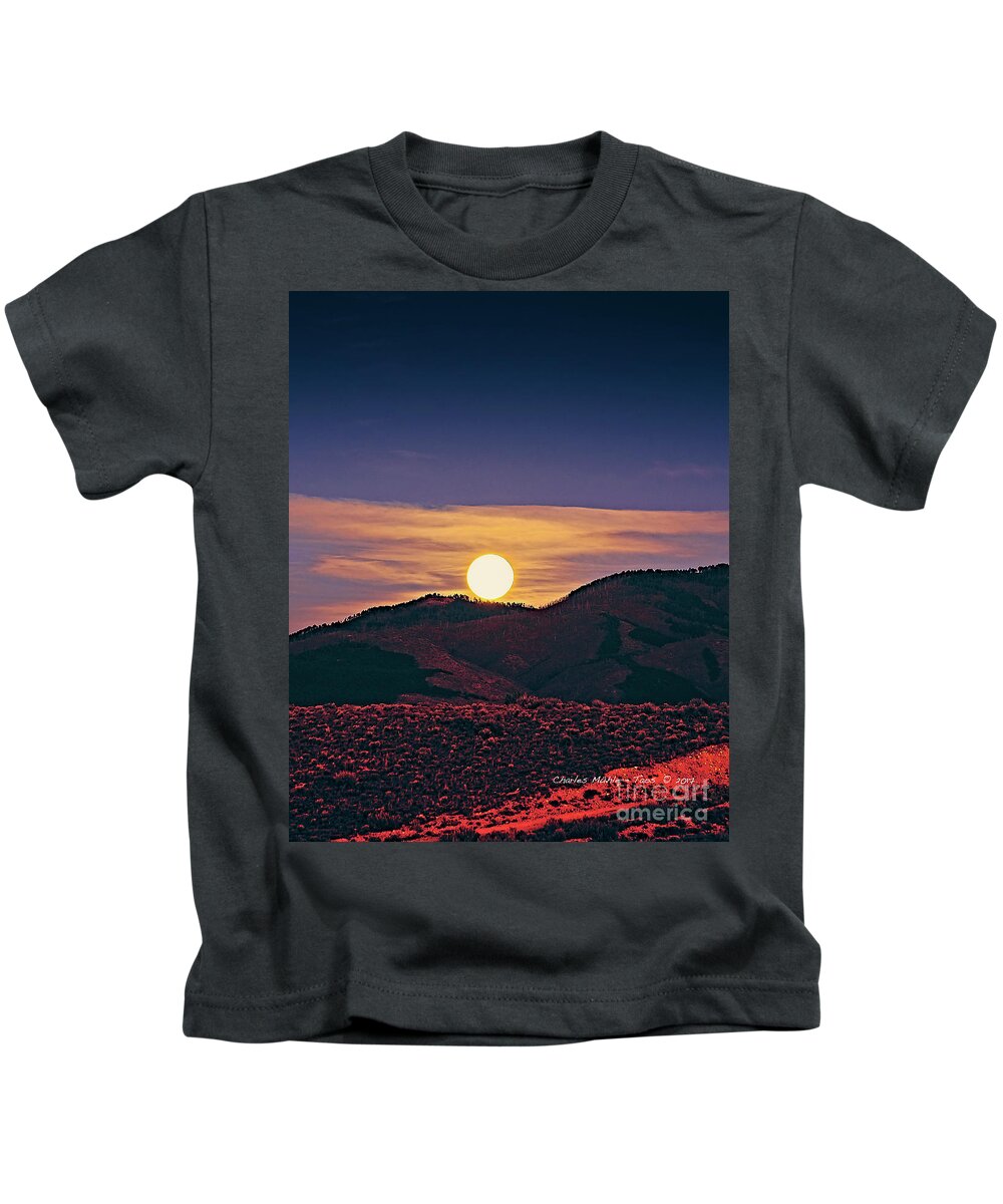 Moonrise Kids T-Shirt featuring the photograph Moonrise in Northern New Mexico by Charles Muhle