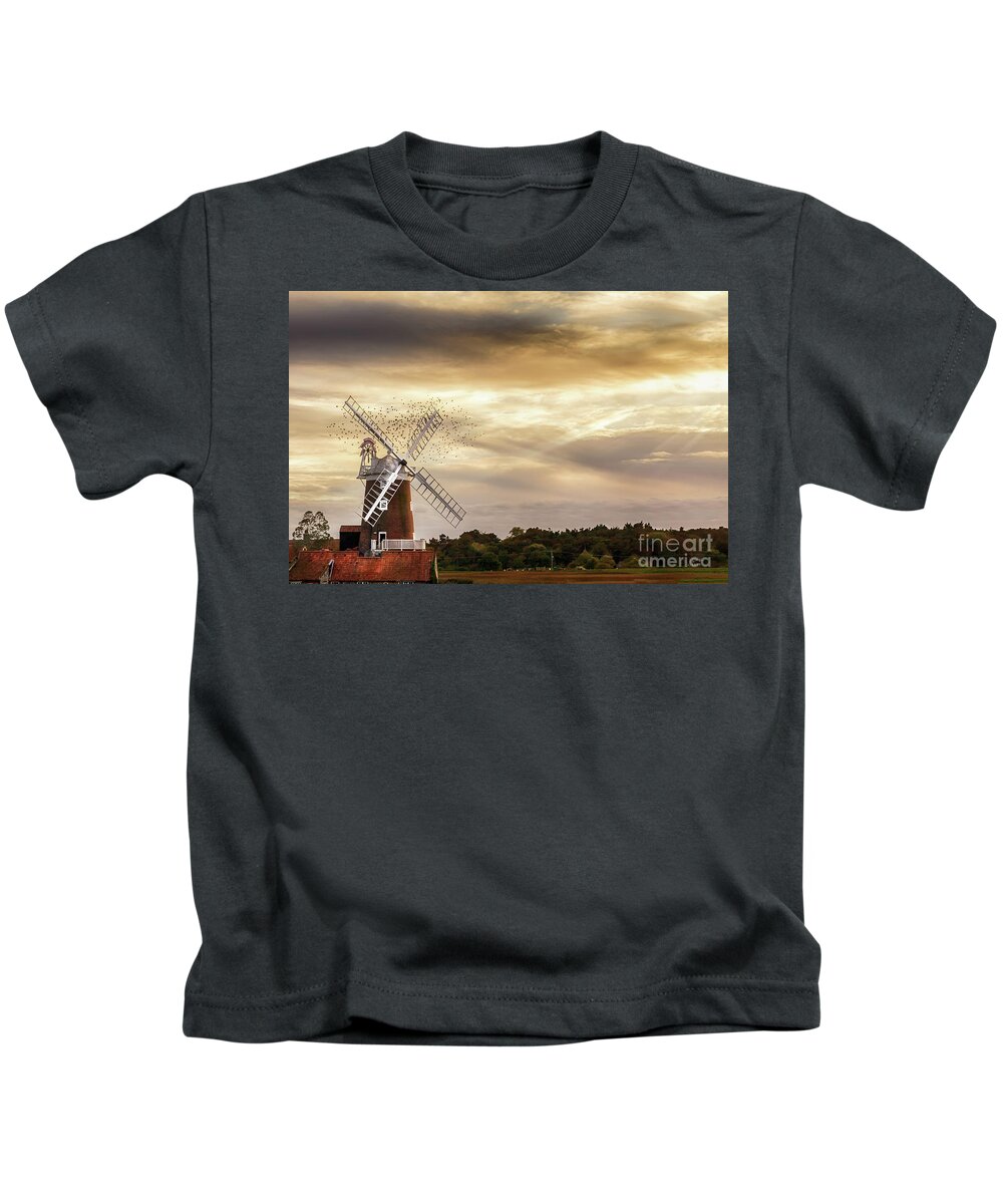 Cley Windmill Kids T-Shirt featuring the photograph Cley windmill Norfolk with flock of birds at sunset by Simon Bratt