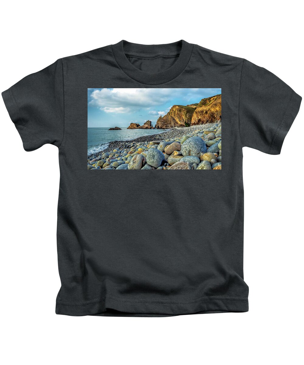 Pebbles Kids T-Shirt featuring the photograph Pebbles on the Beach by Nick Bywater