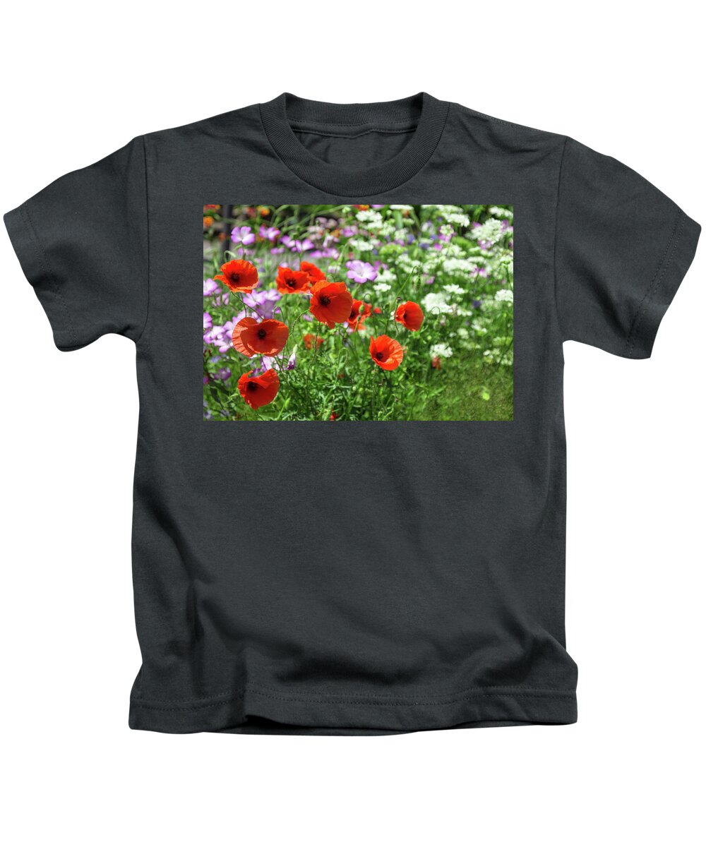 Poppy Kids T-Shirt featuring the photograph Poppies in summer garden by GoodMood Art