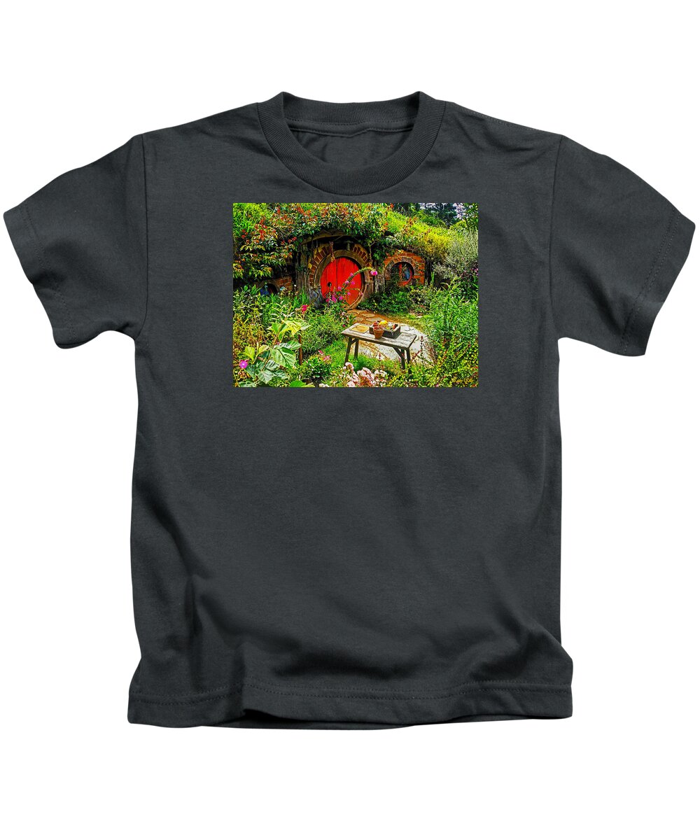 Hobbiton Kids T-Shirt featuring the photograph Red Hobbit Door by Kathy Kelly