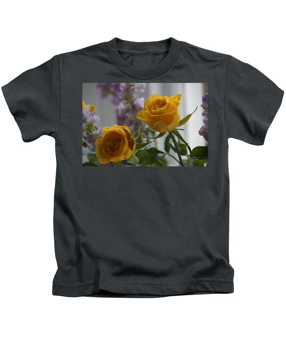 Floral Kids T-Shirt featuring the photograph Roses on window sill. by Elena Perelman