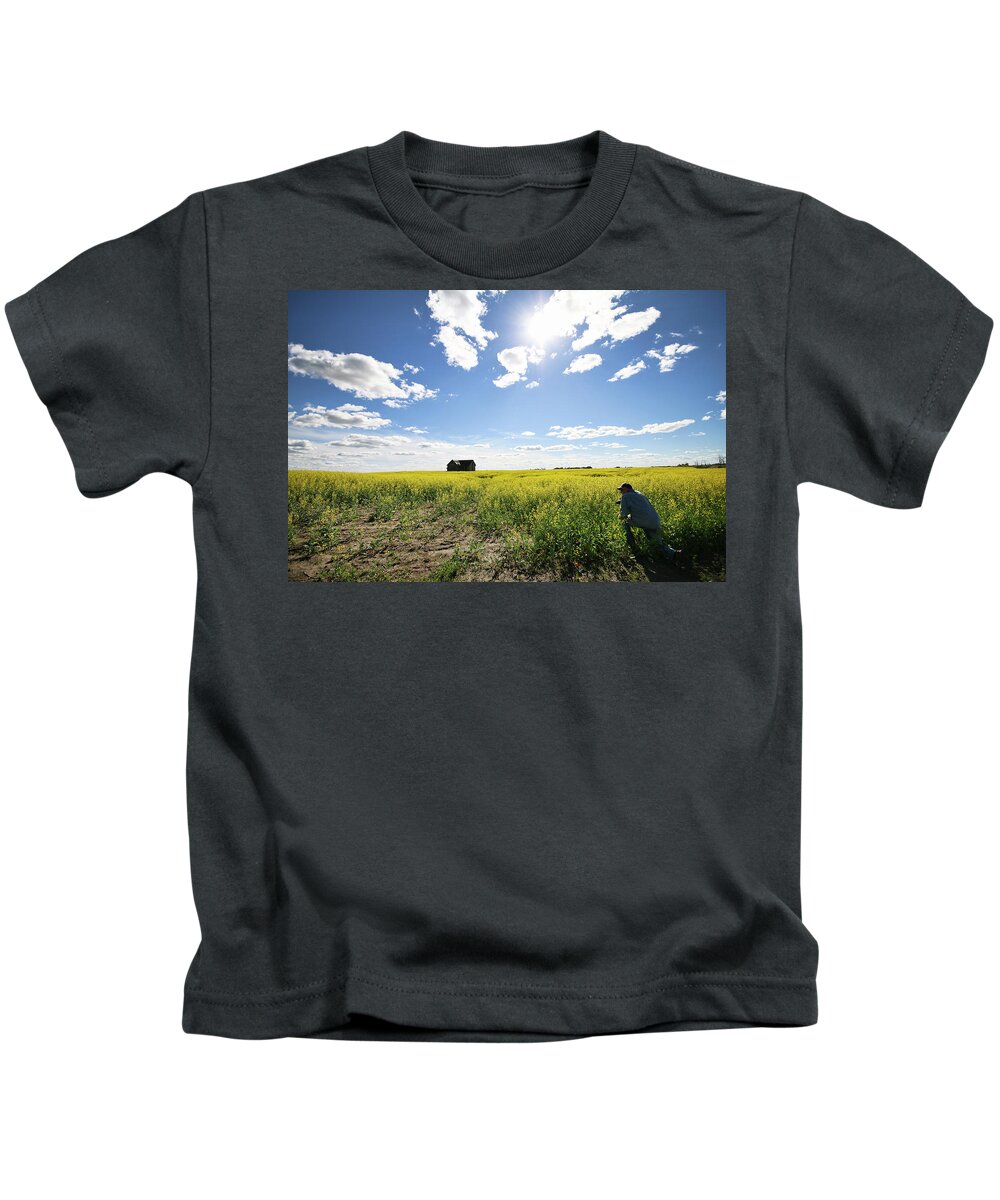 Canola Kids T-Shirt featuring the photograph The Saskatchewan Prairies by Ryan Crouse