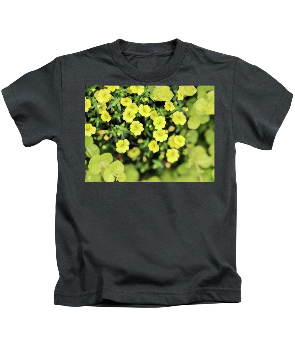 Floral Kids T-Shirt featuring the photograph Tucked Among Greenery by Mary Anne Delgado