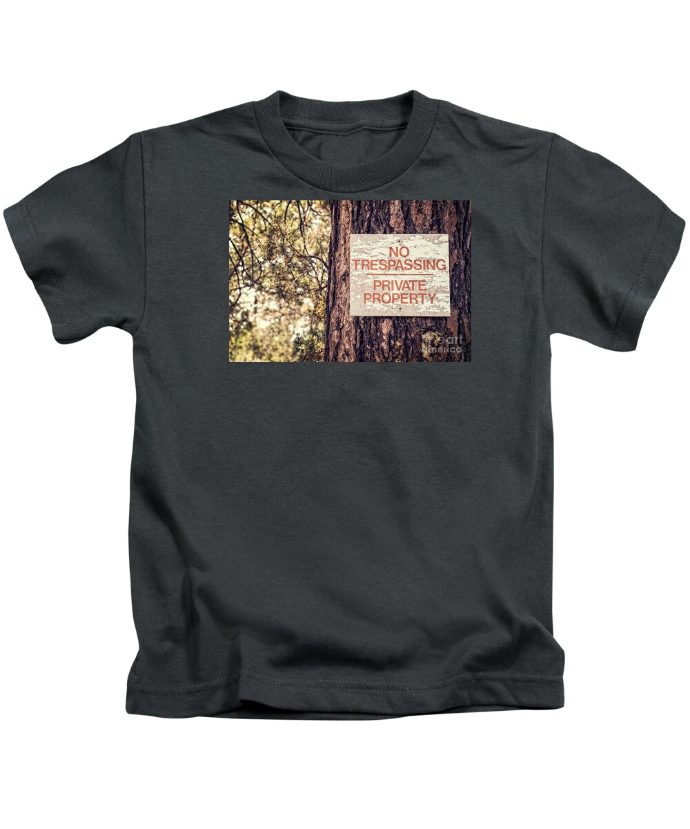 Forest Kids T-Shirt featuring the photograph Weathered No Trespassing Sign on Tree by Bryan Mullennix