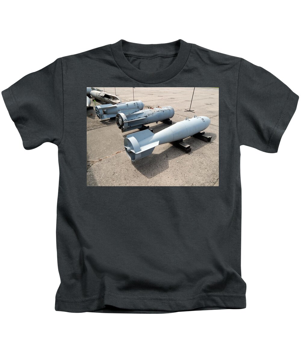 Helicopter Kids T-Shirt featuring the photograph Armament of aircraft and helicopters rockets, bombs, cannons #1 by Oleg Prokopenko