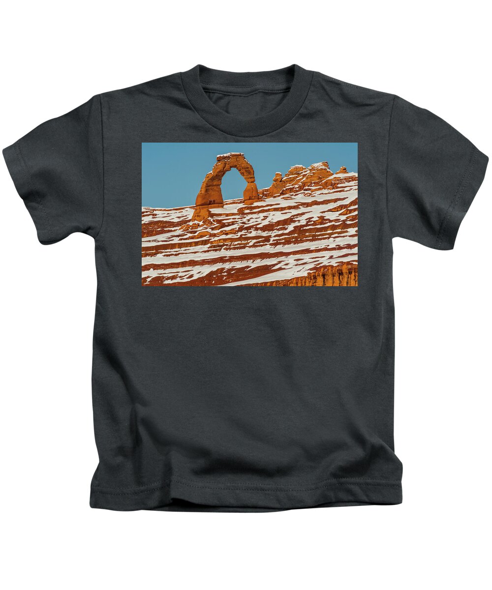 Jeff Foott Kids T-Shirt featuring the photograph Delicate Arch In Winter by Jeff Foott