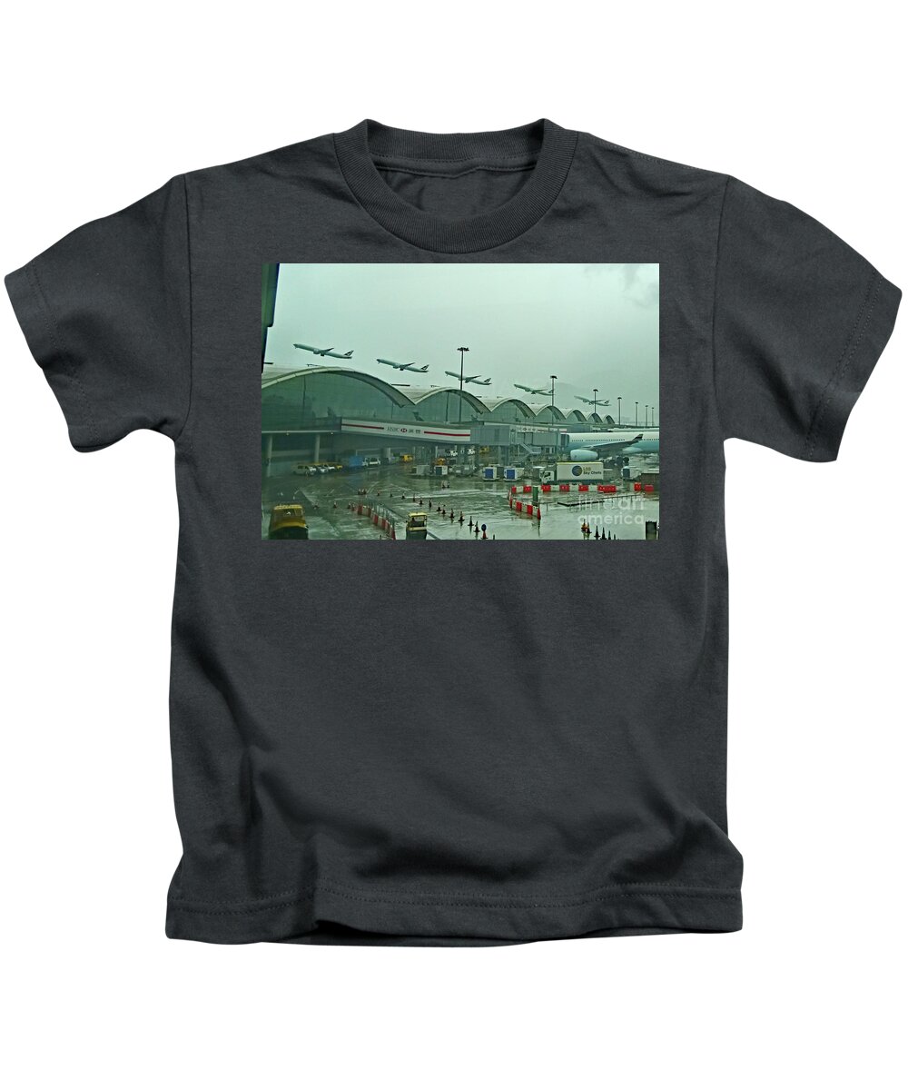 Cathy Pacific Kids T-Shirt featuring the photograph Hongkong Airport - Rainy Day Takeoff by Amazing Action Photo Video