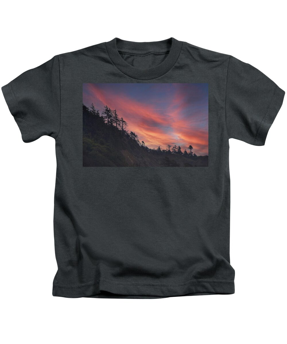 Cannon Kids T-Shirt featuring the photograph Silhouette of conifer against seacoast #3 by Steve Estvanik