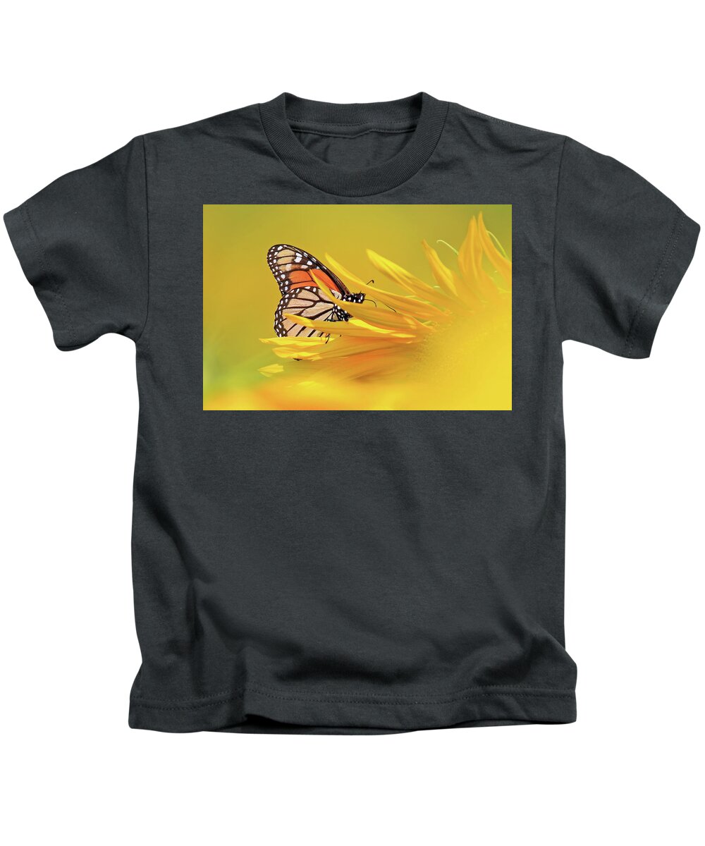 Monarch Butterfly Kids T-Shirt featuring the photograph A Monarch Butterfly on a Sunflower by Shixing Wen