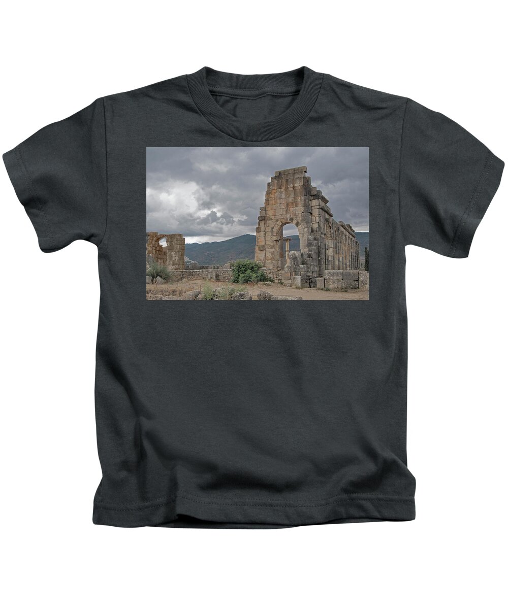 Roman Ruins Kids T-Shirt featuring the photograph A Stormy Past by Edward Shmunes