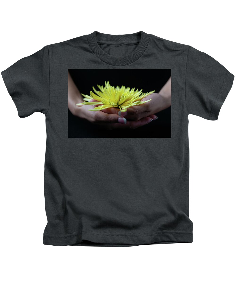 Yoga Kids T-Shirt featuring the photograph Bhairava with Flower by Marian Tagliarino