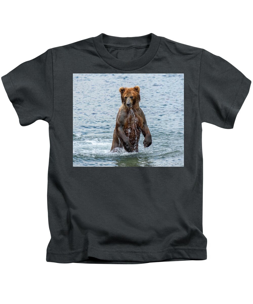 Bear Kids T-Shirt featuring the photograph Brown bear standing in water by Mikhail Kokhanchikov