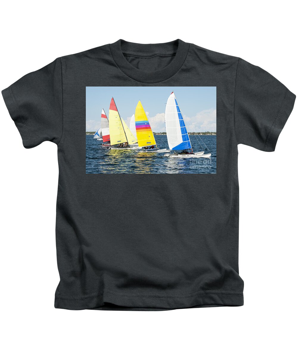 Sky Kids T-Shirt featuring the photograph Children close sailing, racing catamarans with brightly coloured by Geoff Childs