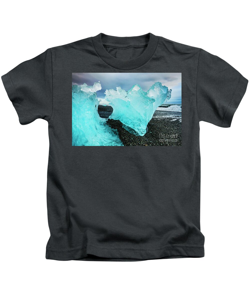 Diamond Beach Kids T-Shirt featuring the photograph Icebergs on Jokulsarlon black beach, Iceland by Neale And Judith Clark